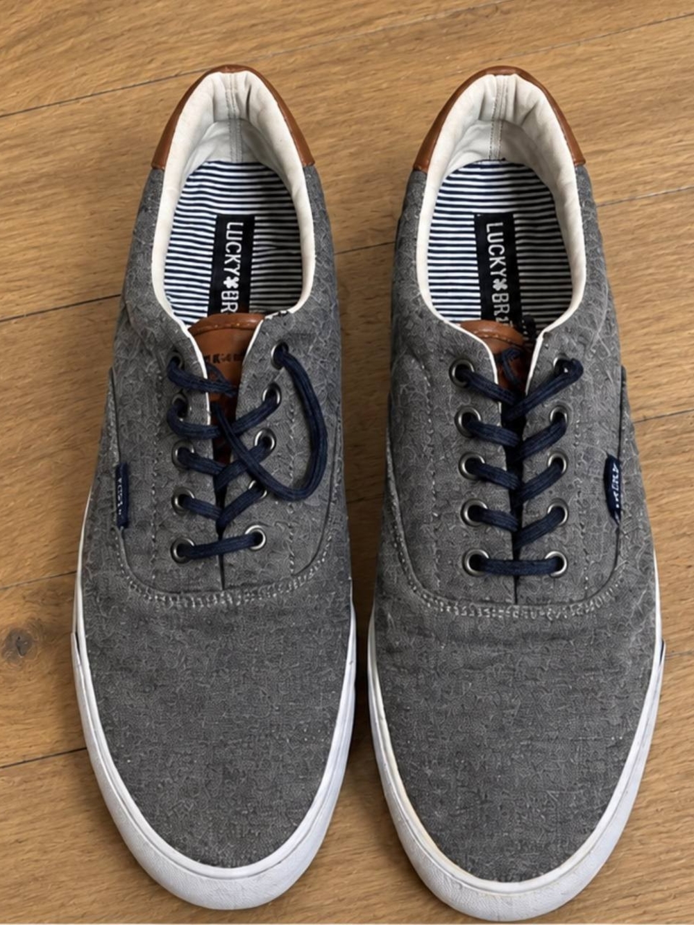 Lucky Brand Men’s Gray Canvas Sneakers with Navy Laces and Brown Heel Accent